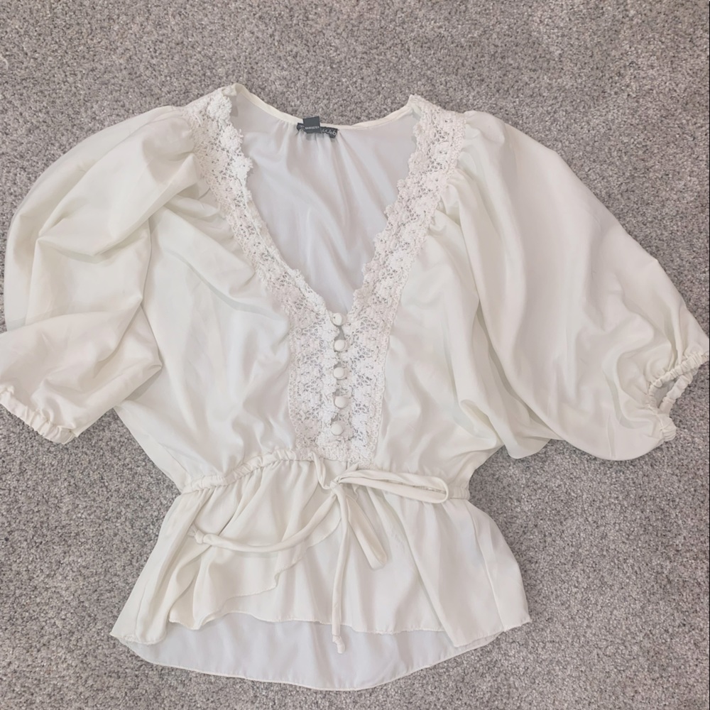 Peasant shirt, wide neck, super cute for dressing up with jeans.